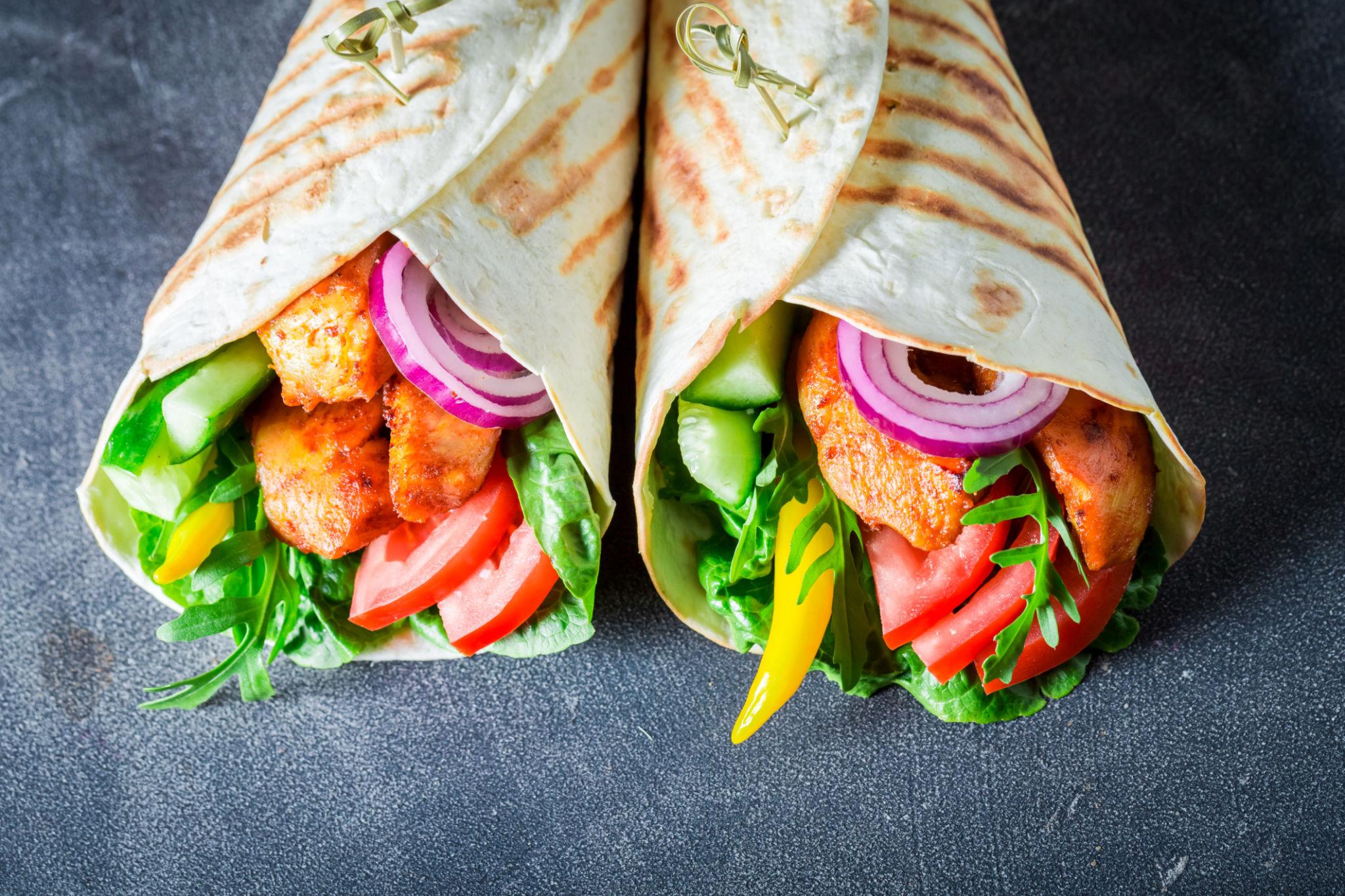 Easy chicken wrap with grilled chicken, vegetables, cheese, and tortilla bread
