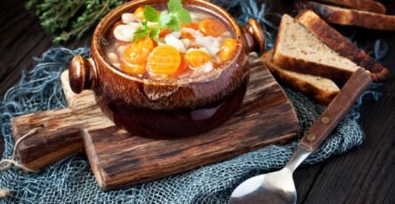 Hearty vegetable soup with carrots, potatoes, and fresh herbs in a bowl