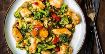 Honey garlic chicken stir fry with vegetables and glossy sauce served in a bowl