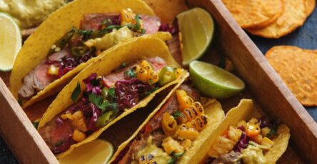 Classic beef tacos with seasoned meat, lettuce, tomatoes, and cheese
