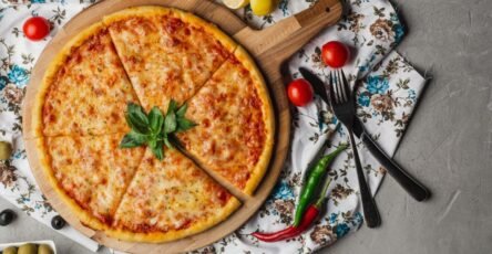 Homemade Margherita pizza with mozzarella cheese, tomato sauce, and fresh basil