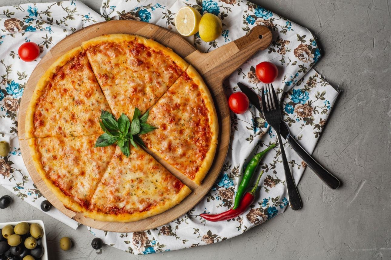 Homemade Margherita pizza with mozzarella cheese, tomato sauce, and fresh basil